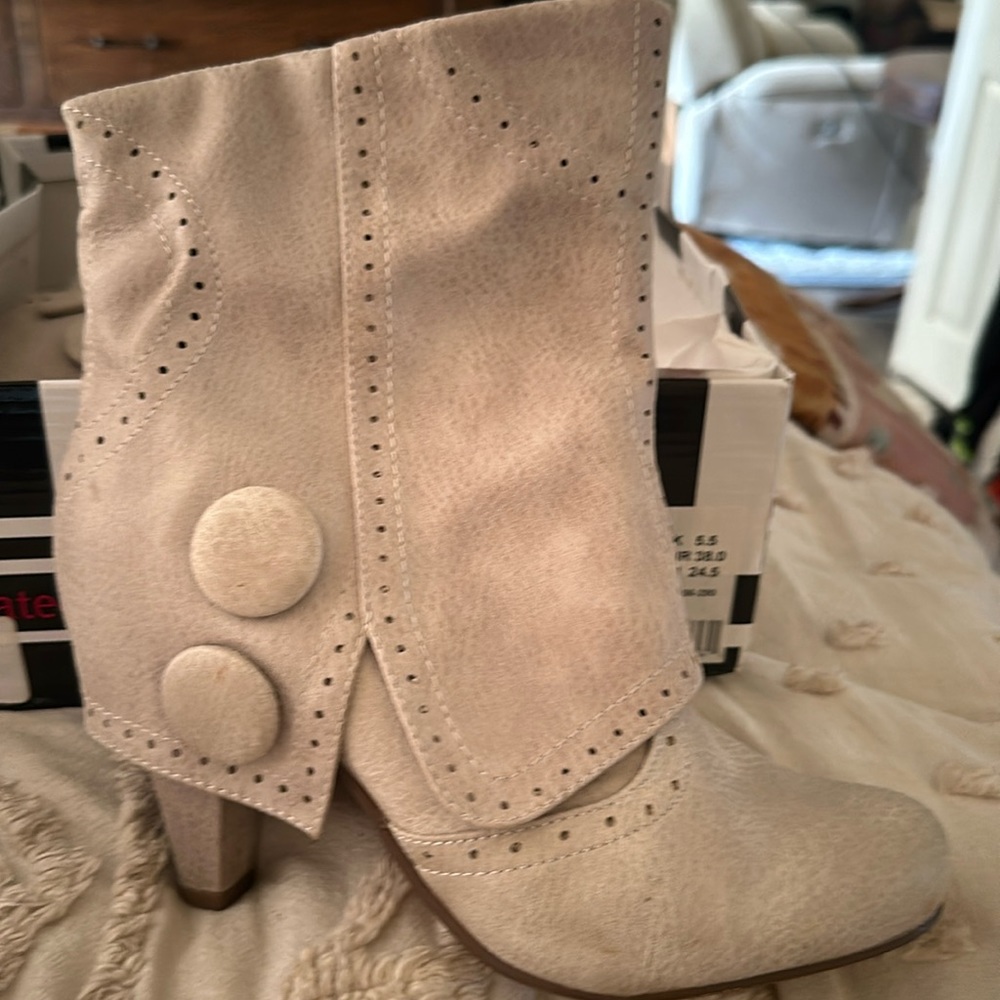 Not Rated Booties worn once small little nick in left boot as pictured